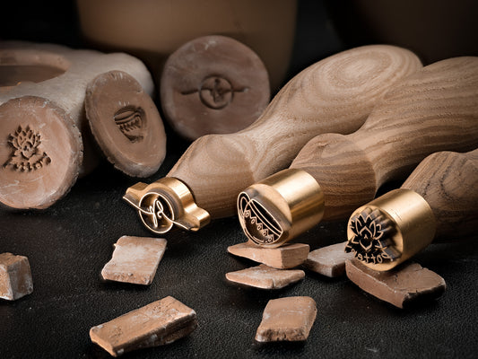 Custom pottery stamp made of brass with wooden handle for marking clay, ceramics and soap