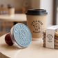 Custom coffee cup logo stamp branding a kraft paper sleeve